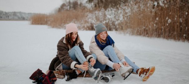 winter activities sudbury, 2 girls tying shoes